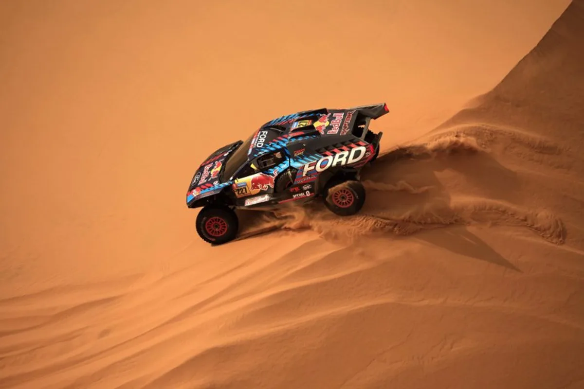 Spanish driver Nani Roma and Spanish co-driver Alex Haro compete during Stage 7 of the Dakar Rally 2025, between Al Duwadimi and Al Duwadimi, Saudi Arabia, on January 12, 2025.  Valery HACHE / AFP