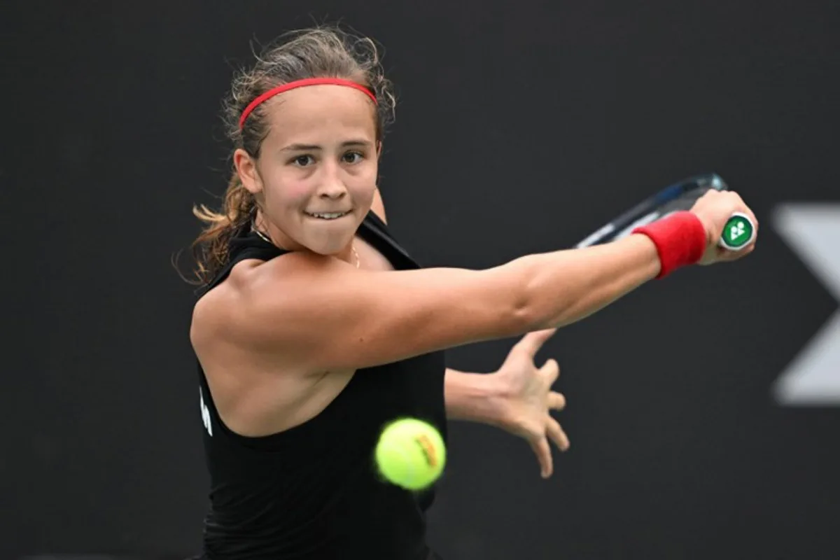 Belgium's Hanne Vandewinkel hits a return to China's Wei Sijia during their women's singles match at the Billie Jean King Cup tennis play-offs at the Guangzhou Nansha International Tennis Center in Guangzhou, in south China's Guangdong province on November 17, 2024.  STR / AFP