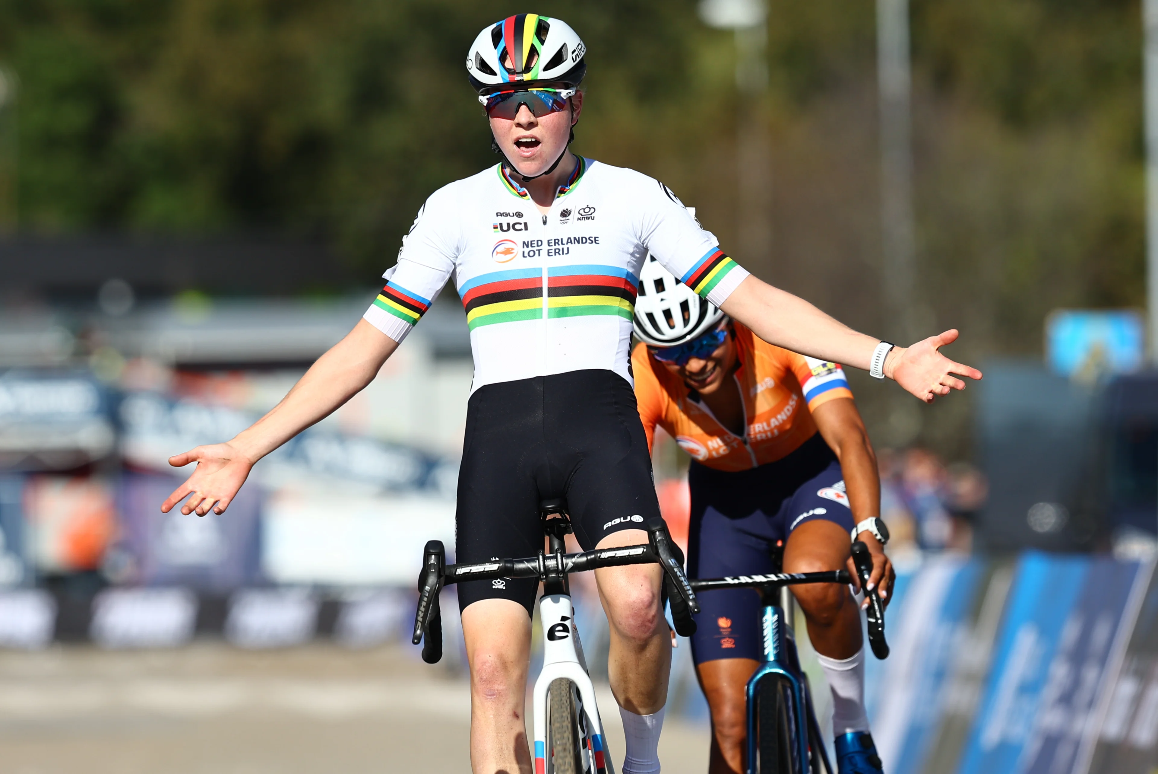 Dutch Fem Van Empel celebrates as she crosses the finish line to win, before Dutch Ceylin Del Carmen Alvarado (rear) the Women Elite race at the European Championships cyclocross cycling in Pontevedra, Spain, Sunday 03 November 2024. BELGA PHOTO DAVID PINTENS