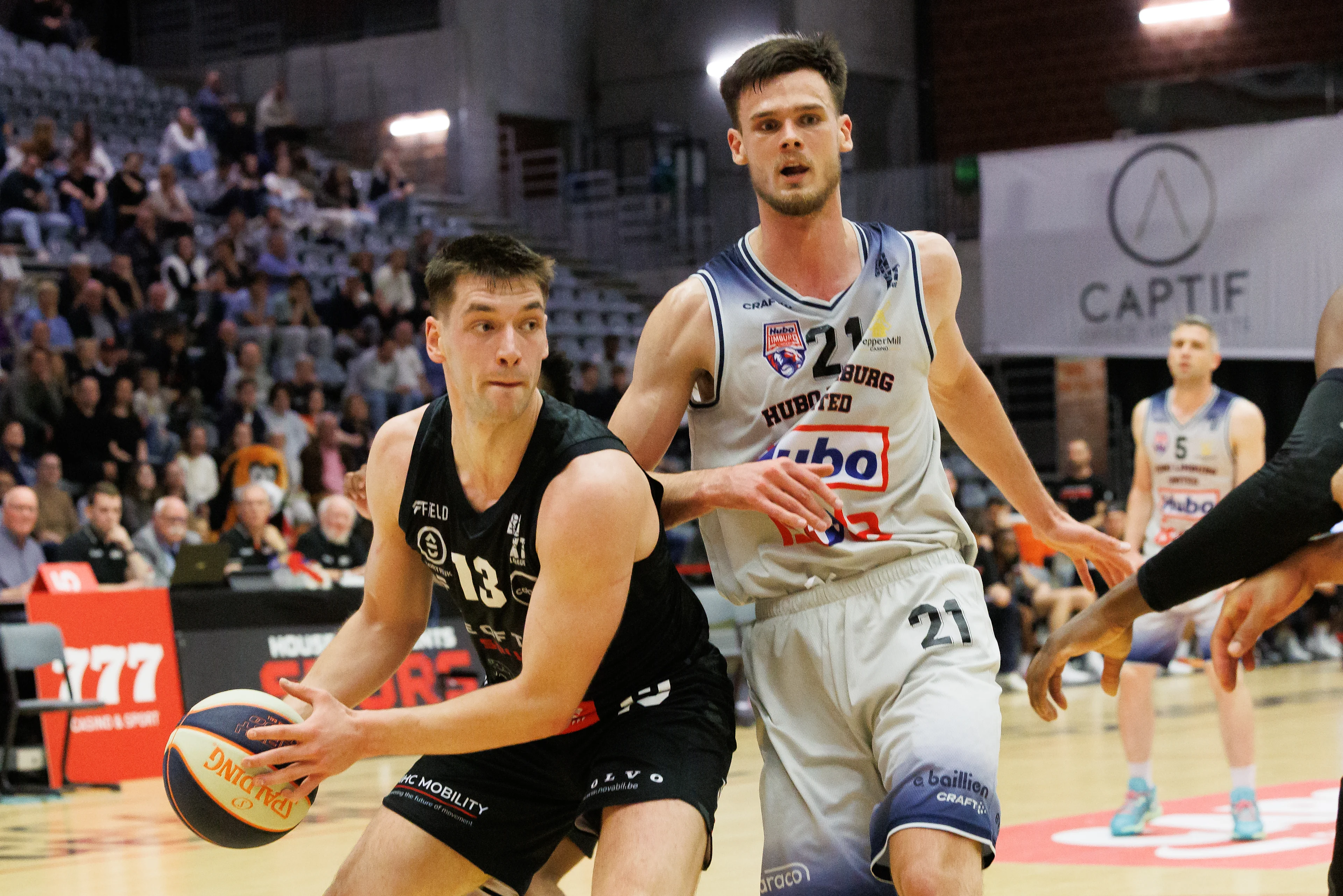 Kortrijk's Niels De Ridder and Limburg's Thibault Vanderhaegen fight for the ball during a basketball match between House of Talents Spurs Kortrijk and Limburg United, Friday 25 October 2024, in Kortrijk, on day 8 of the 'BNXT League' first division basket championship. BELGA PHOTO KURT DESPLENTER