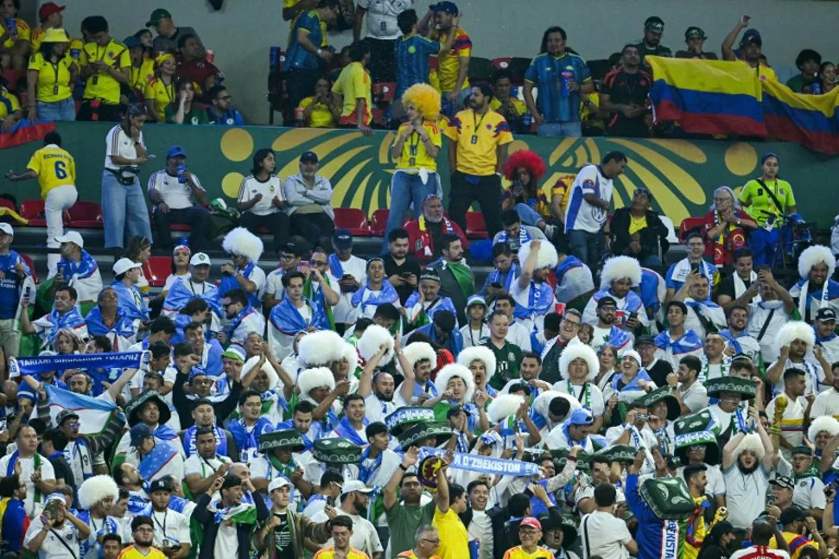 Uzbek fans cheer for their team during the 2026 World Cup Group K football match between Uzbekistan and Colombia at the Mexico City Stadium in Mexico City on June 17, 2026. Yuri CORTEZ / AFP