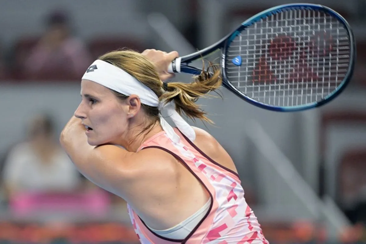 Belgium's Greet Minnen hits a return to China's Zhang Shuai during their women's singles match at the China Open tennis tournament in Beijing on September 29, 2024.  Jade Gao / AFP