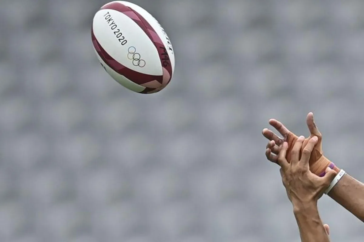 Fiji's Mele Derenalagi (R) fights for the ball with Argentina's Lucio Cinti (L) in the men's semi-final rugby sevens match between Argentina and Fiji during the Tokyo 2020 Olympic Games at the Tokyo Stadium in Tokyo on July 28, 2021. Ben STANSALL / AFP