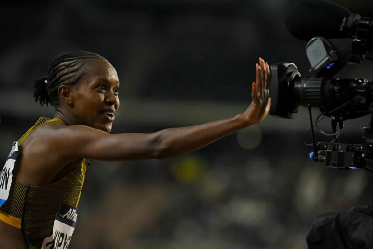 Kenya's Faith Kipyegon celebrates after winning the Women's 1500m final of the Memorial Van Damme Diamond League athletics finals at the Roi Baudouin Stadium in Brussels on September 14, 2024. NICOLAS TUCAT / AFP