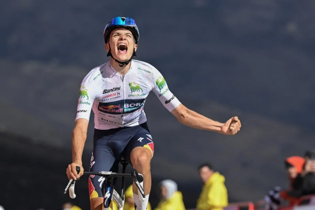 Team Bora's Italian rider Giulio Pellizzari celebrates as he crosses the finish line to win the 17th stage of the Vuelta a Espana, a 143 km race between O Barco de Valdeorras and Alto de El Morredero, Ponferrada, on September 10, 2025. Miguel RIOPA / AFP