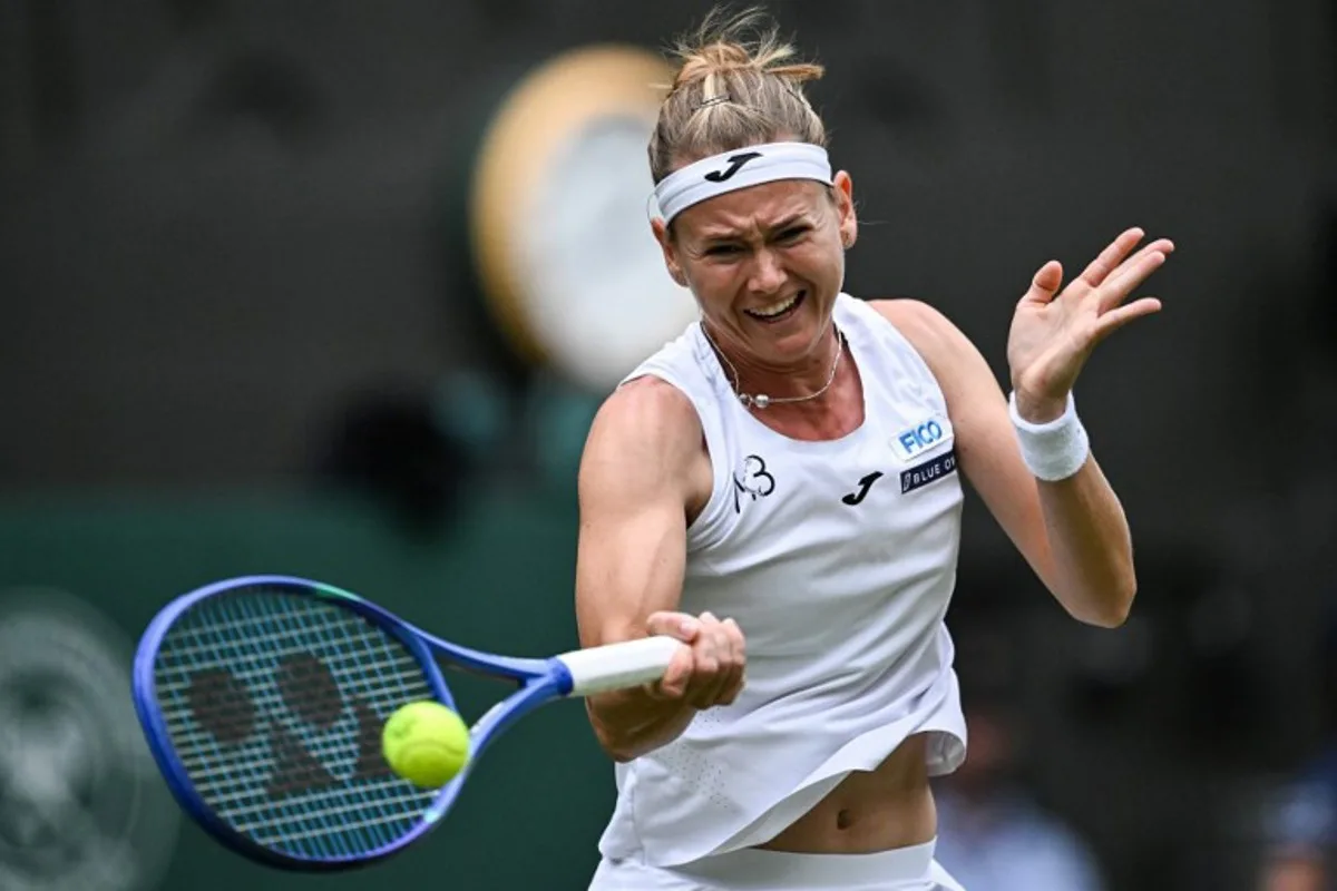 Czech Republic's Marie Bouzkova plays a forehand return to Belarus's Aryna Sabalenka during their women's singles second round tennis match on the third day of the 2025 Wimbledon Championships at The All England Lawn Tennis and Croquet Club in Wimbledon, southwest London, on July 2, 2025. Kirill KUDRYAVTSEV / AFP