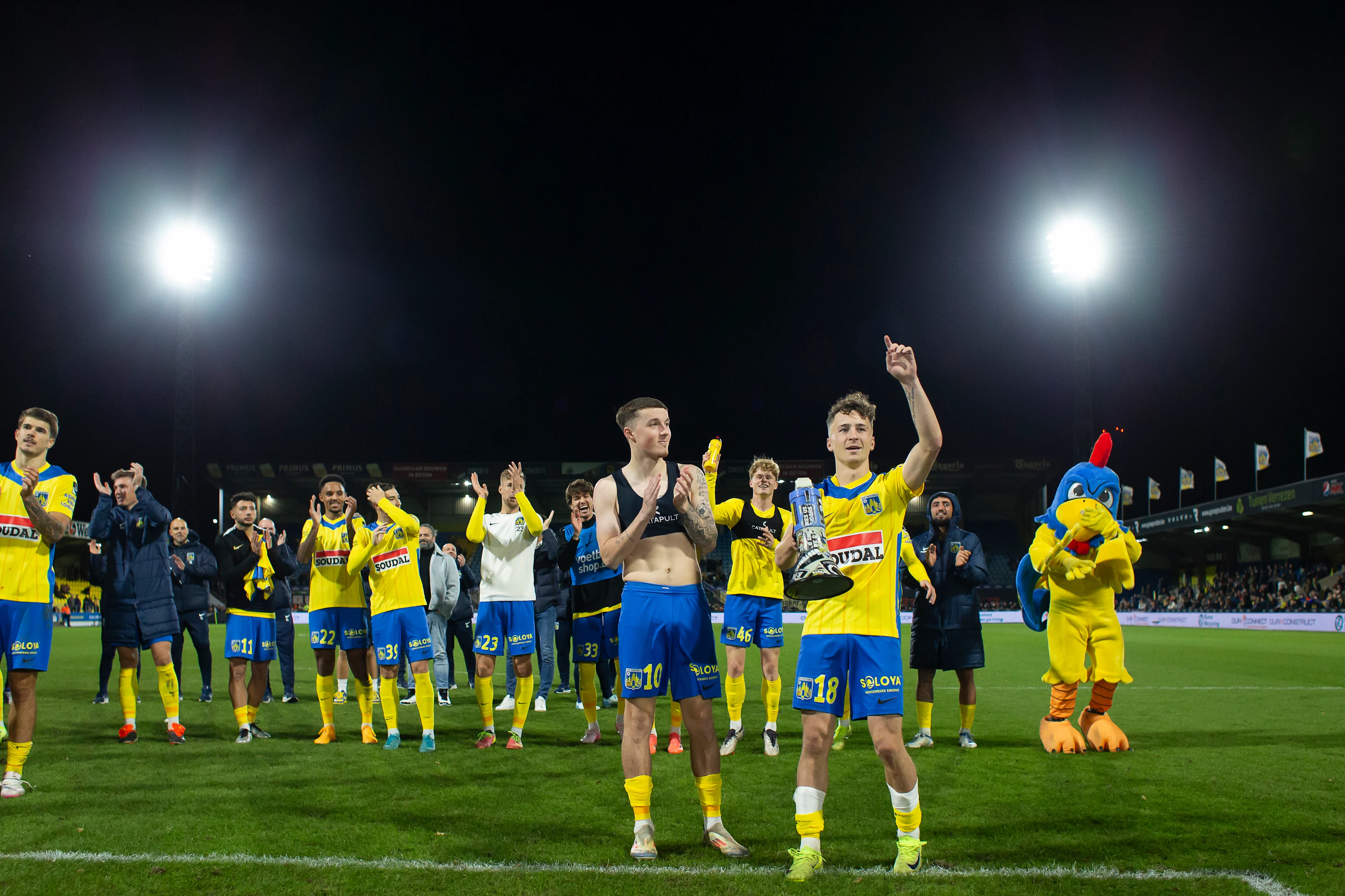 Westerlo's Alfie Devine and Westerlo's Griffin Yow celebrate after winning a soccer match between KVC Westerlo and KV Kortrijk, in Westerlo, on day 15 of the 2024-2025 season of the 'Jupiler Pro League' first division of the Belgian championship, Sunday 24 November 2024. BELGA PHOTO KRISTOF VAN ACCOM