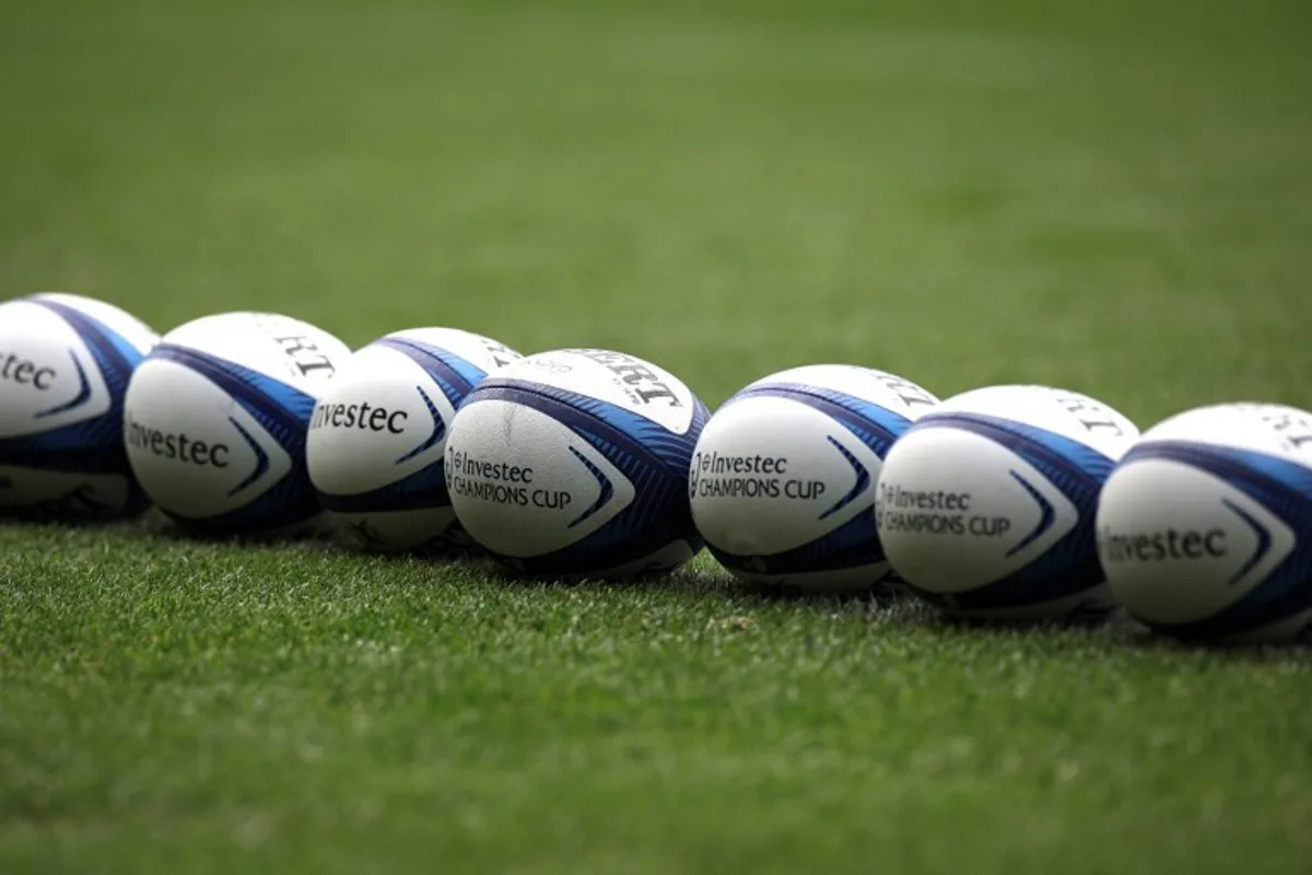 Rugby balls are lined up during a captain's run training session at the Stadium in Toulouse, southwestern France, on May 4, 2024, on the eve of the European Rugby Champions Cup demi-final rugby union match between Stade Toulousain Rugby (Toulouse) and Harlequins.  Valentine CHAPUIS / AFP