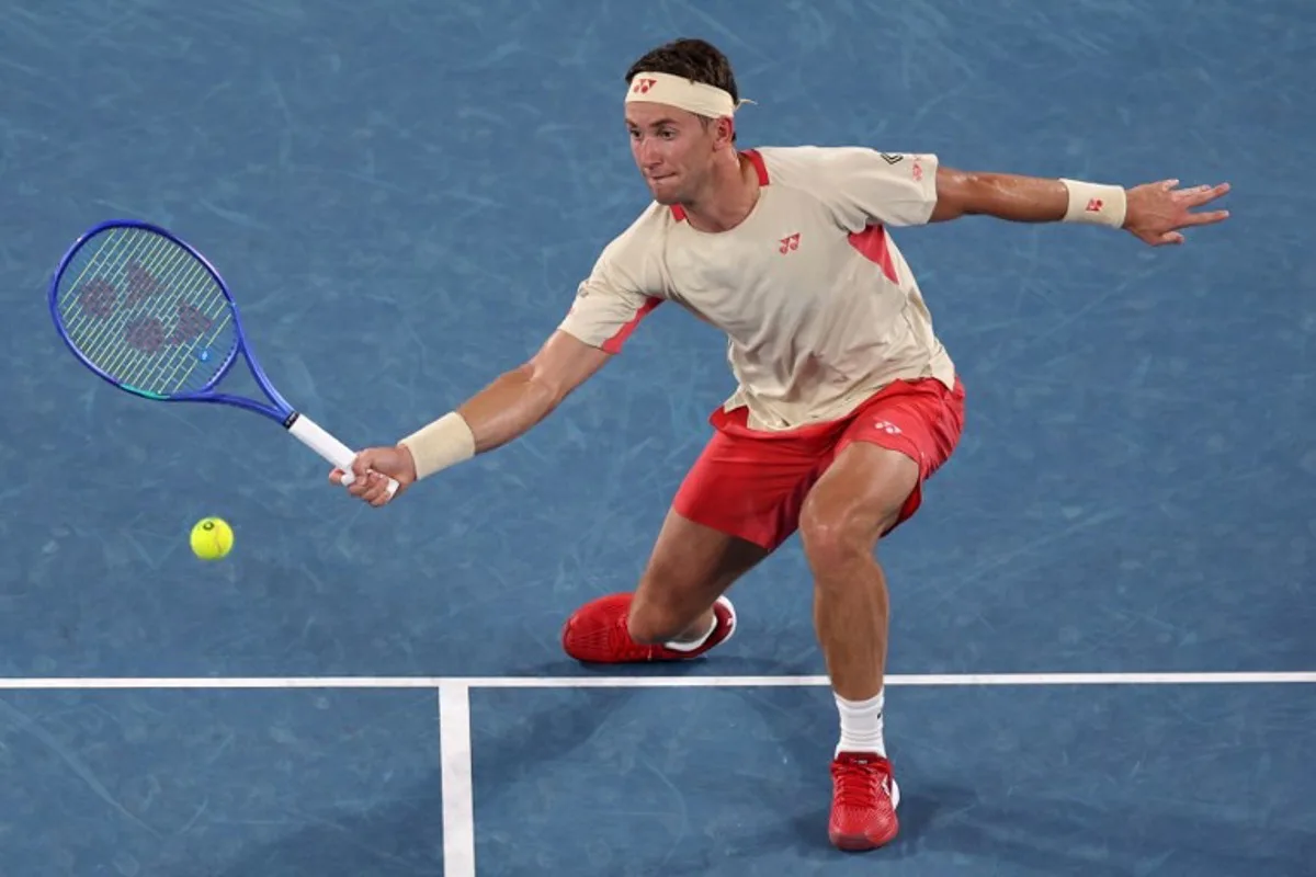 Norway's Casper Ruud hits a shot against Czech Republic's Jakub Mensik during their men's singles match on day four of the Australian Open tennis tournament in Melbourne on January 15, 2025.  Adrian DENNIS / AFP