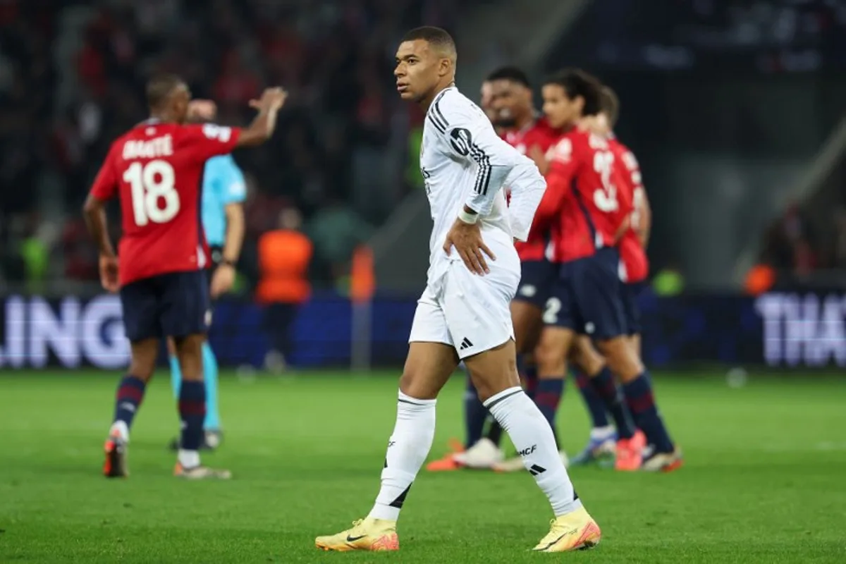 Real Madrid's French forward #09 Kylian Mbappe reacts after losing the UEFA Champions League football match between Lille LOSC and Real Madrid at the Pierre Mauroy Stadium in Villeneuve-d'Ascq, northern France, on October 2, 2024.  FRANCK FIFE / AFP