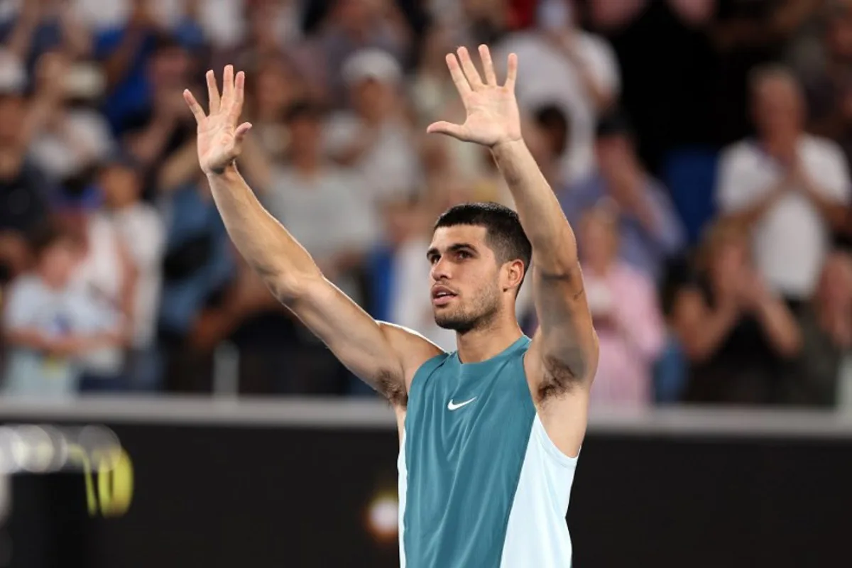 Spain's Carlos Alcaraz celebrates victory over Kazakhstan's Alexander Shevchenko after their men's singles match on day two of the Australian Open tennis tournament in Melbourne on January 13, 2025.  Martin KEEP / AFP