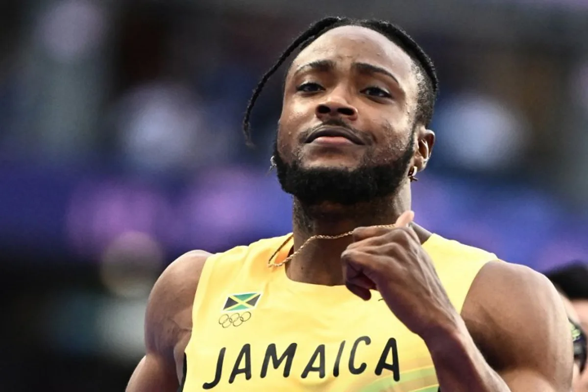 Jamaica's Kishane Thompson reacts after competing in the men's 100m semi-final of the athletics event at the Paris 2024 Olympic Games at Stade de France in Saint-Denis, north of Paris, on August 4, 2024. Jewel SAMAD / AFP