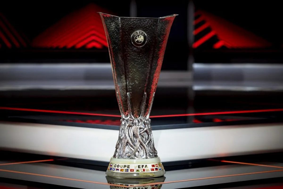 This photograph shows the UEFA Europa League trophy on the stage before the ceremony of the draw for the group stage of the 2024-2025 UEFA Europa League tournament, at the Grimaldi Forum in Monaco on August 30, 2024.  Valery HACHE / AFP