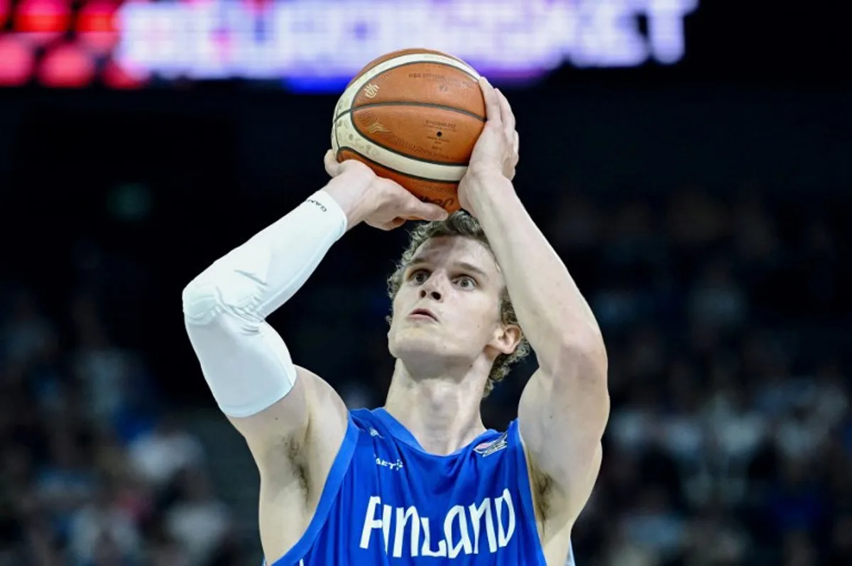 Finland's center #23 Lauri Markkanen shoots during the FIBA EuroBasket 2025 Group B basketball match between Sweden and Finland in Tampere, Finland, on August 27, 2025. Heikki Saukkomaa / Lehtikuva / AFP