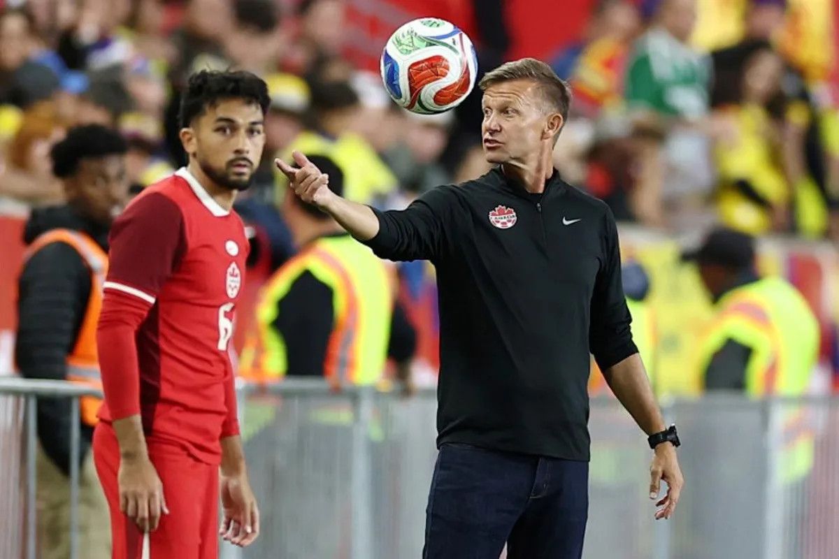 (FILES) Canada's US coach Jesse Marsch gestures to his players from the touchline during the international friendly football match between Canada and Colombia at Sports Illustrated Stadium in Harrison, New Jersey, on October 14, 2025. Exactly 150 years after the Carlton Cricket Club and the Toronto Lacrosse Club played the first recorded organized soccer match in Canada, in 1876, Canadian soccer is finally preparing to make its World Cup debut as host. CHARLY TRIBALLEAU / AFP