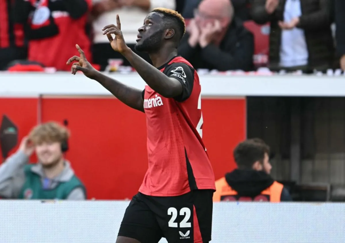 Bayer Leverkusen's Nigerian forward #22 Victor Boniface celebrates scoring during the German first division Bundesliga football match between XBayer Leverkusen and Eintracht Frankfurt in Leverkusen on October 19, 2024.  INA FASSBENDER / AFP