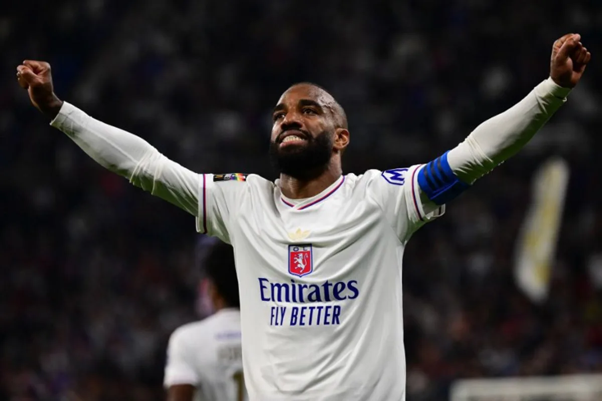 Lyon's French forward #10 Alexandre Lacazette celebrates after scoring a goal during the French L1 football match between Olympique Lyonnais (OL) and SCO Angers at The Groupama Stadium in Decines-Charpieu, central-eastern France on May 17, 2025. OLIVIER CHASSIGNOLE / AFP