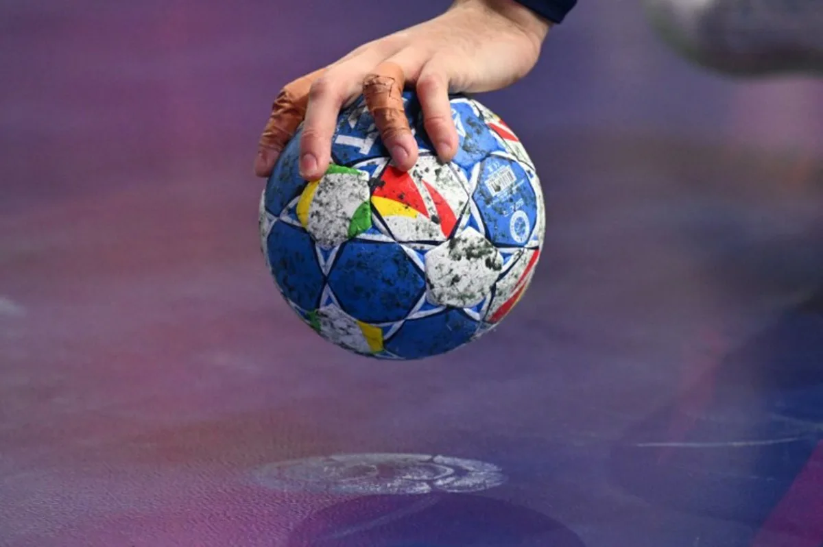 France's centre back #05 Nedim Remili holds the ball during the Men's EURO 2024 EHF Handball European Championship final match between France and Denmark in Cologne, western Germany on January 28, 2024.  Kirill KUDRYAVTSEV / AFP