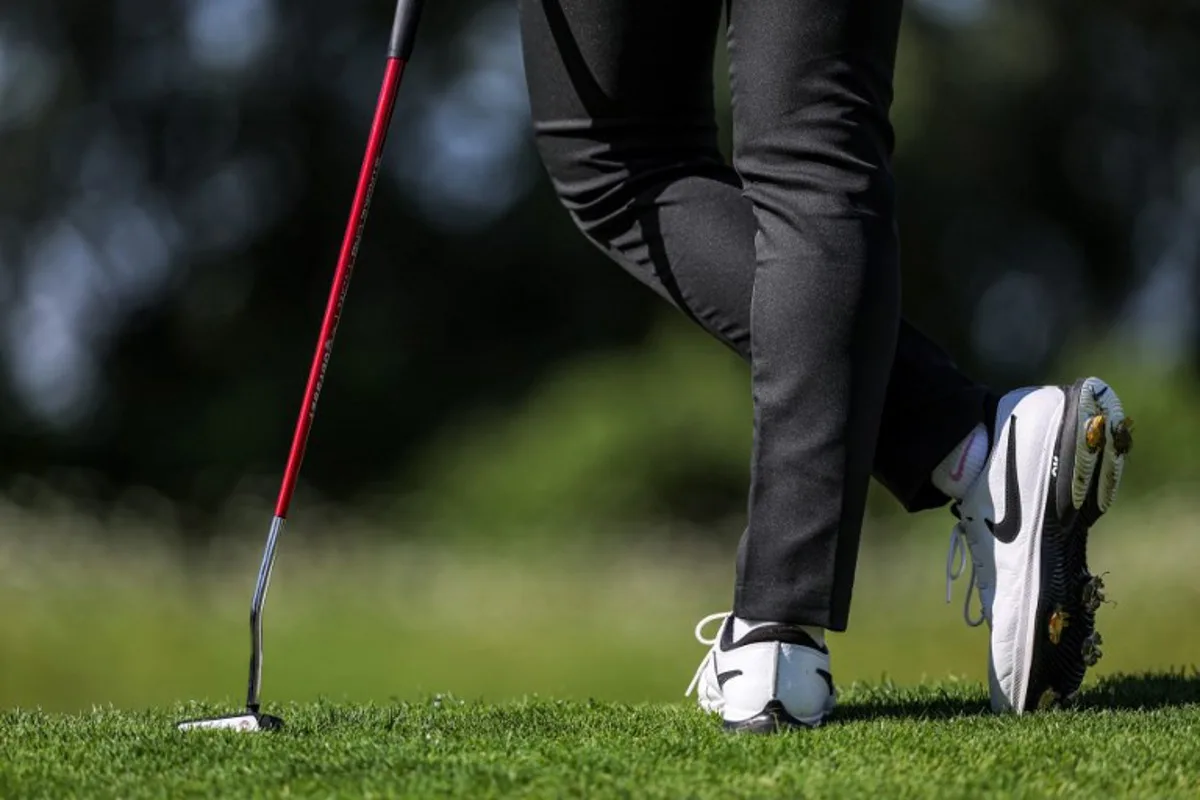 Thailand's Atthaya Thitikul stands during round 2 of the women's golf individual stroke play of the Paris 2024 Olympic Games at Le Golf National in Guyancourt, south-west of Paris on August 8, 2024.   Pierre-Philippe MARCOU / AFP