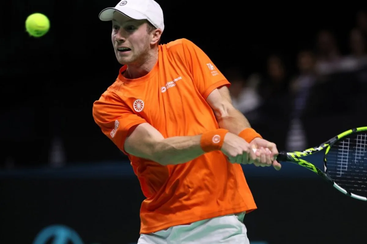 Botic Van de Zandschulp of Team Netherlands returns a shot to Daniel Altmaier of Team Germany during their semi-final singles match between Germany and Netherlands at the Davis Cup Finals at the Palacio de Deportes Jose Maria Martin Carpena arena in Malaga, southern Spain, on November 22, 2024.  Thomas COEX / AFP