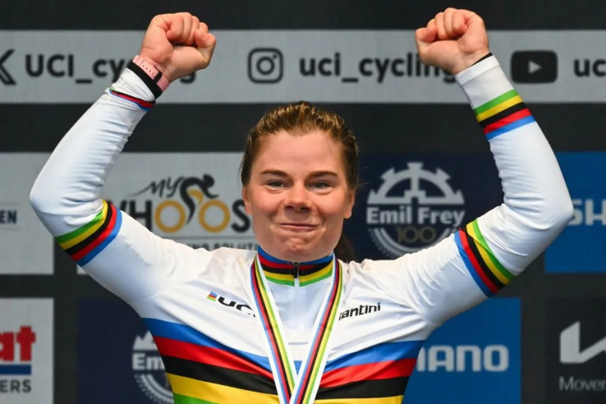 Winner Belgium's Lotte Kopecky celebrates during the podium ceremony of the women's Elite Road Race cycling event as part of the UCI 2024 Road World Championships, in Zurich, on September 28, 2024.  Fabrice COFFRINI / AFP