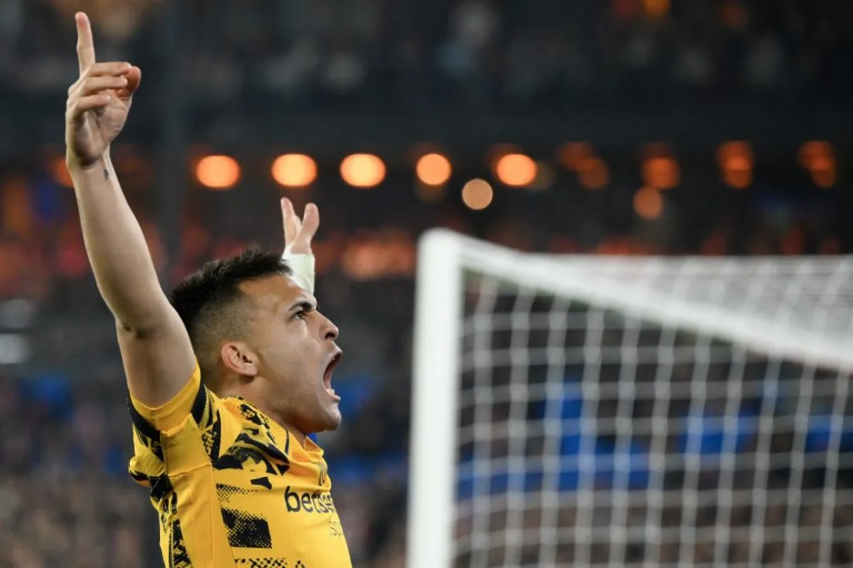 Inter Milan's Argentine forward #10 Lautaro Martinez celebrates scoring his team's second goal during the UEFA Champions League round of 16 first leg football match between Feyenoord (NED) and Inter Milan (ITA) at the Feyenoord Stadium known as De Kuip stadium, in Rotterdam, on March 5, 2025.  JOHN THYS / AFP