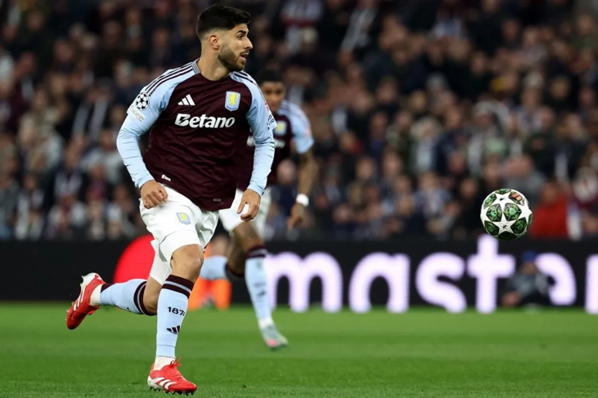 Aston Villa's Spanish midfielder #21 Marco Asensio controls the ball during the UEFA Champions League quarter-final second-leg football match between Aston Villa and Paris Saint-Germain at Villa Park in Birmingham, central England on April 15, 2025. FRANCK FIFE / AFP
