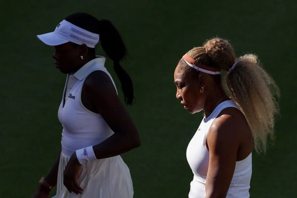 US player Serena Williams (R) walks with Canada's Victoria Mboko (L) while playing against US player Nicole Melichar-Martinez and New Zealand's Erin Routliffe during their round of 16, doubles match at the HSBC WTA tennis Championships at Queen's Club in west London on June 9, 2026.  Adrian Dennis / AFP