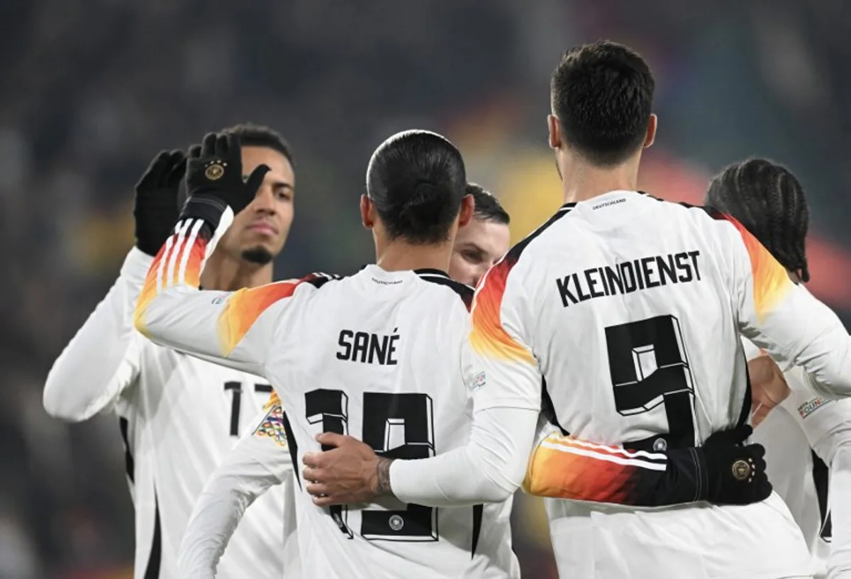 Germany's midfielder #19 Leroy Sane (2L) celebrates with teammates scoring his team's sixth goal during the UEFA Nations League football match between Germany and Bosnia and Herzegovina, in Freiburg, on November 16, 2024.   THOMAS KIENZLE / AFP