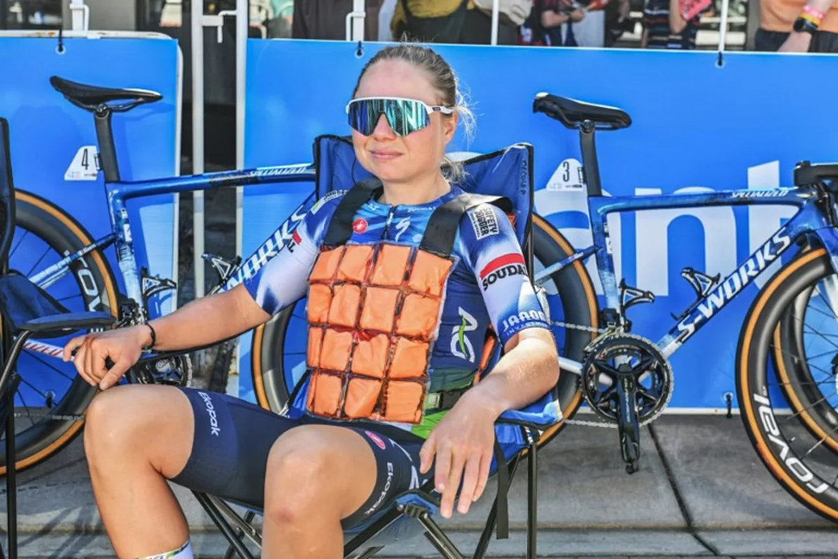 TEAM AG Insurance-Soudal cycling team rider Justine Ghekiere from Belgium cools down with an ice vest before the start of the second stage of the Tour Down Under cycling race in Adelaide on January 18, 2025.  Brenton Edwards / AFP