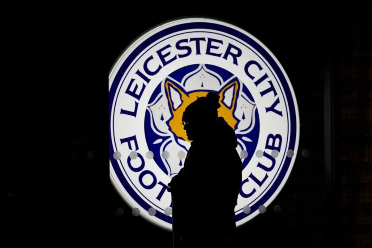 A supporter arrives at King Power Stadium in Leicester, central England prior to the English Premier League football match between Leicester City and Brentford, on February 21, 2025.  Darren Staples / AFP