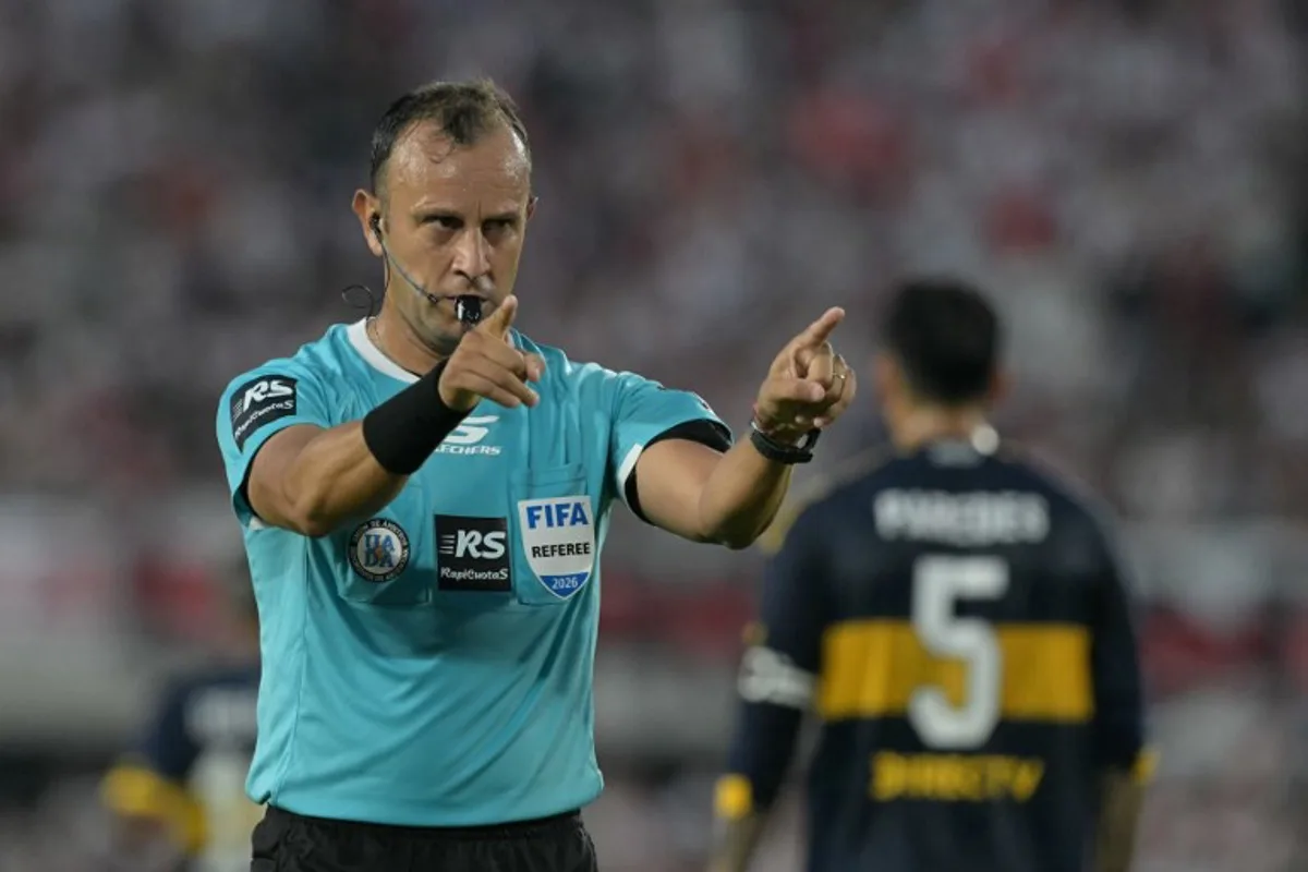Argentine referee Dario Herrera gestures during the Argentine Professional Football League 2026 Apertura Tournament match between River Plate and Boca Juniors at MAS Monumental stadium in Buenos Aires on April 19, 2026. JUAN MABROMATA / AFP