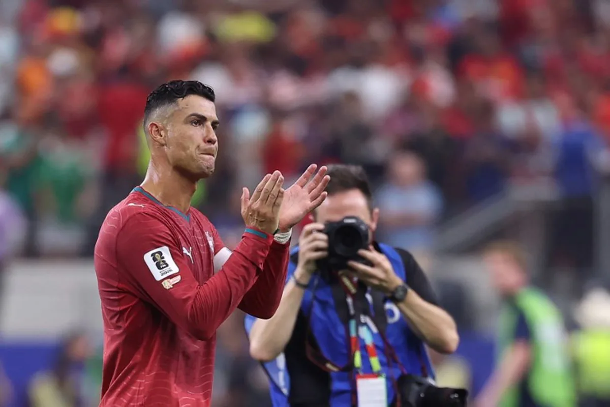 Portugal's forward #07 Cristiano Ronaldo greets fans after losing the 2026 World Cup round of 16 football match between Portugal and Spain at the Dallas Stadium in Arlington on July 6, 2026. Thomas COEX / AFP