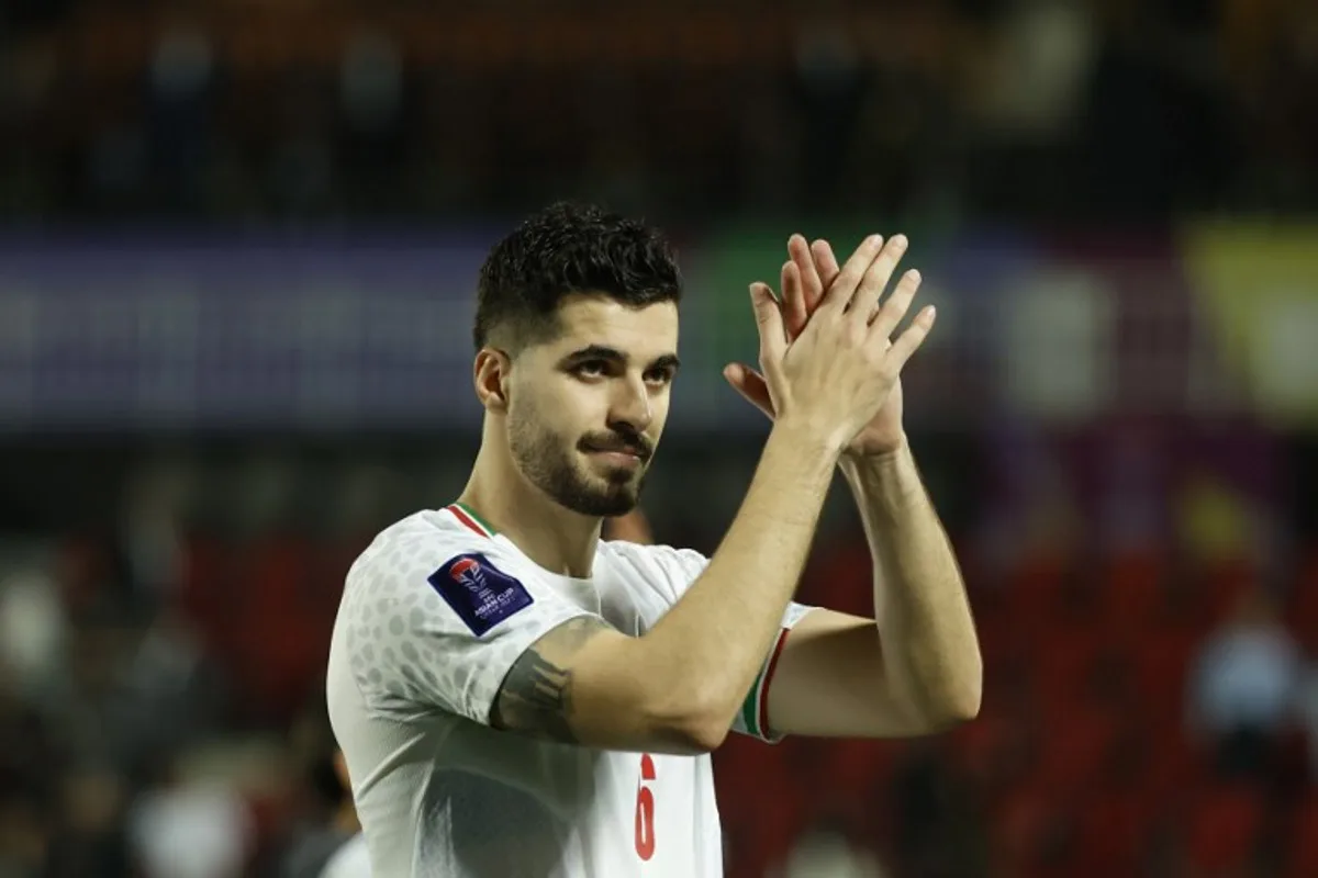 Iran's midfielder #06 Saeid Ezatolahi applauds the fans at the end of the Qatar 2023 AFC Asian Cup football match between Iran and Syria at the Abdullah bin Khalifa Stadium in Doha on January 31, 2024.  KARIM JAAFAR / AFP