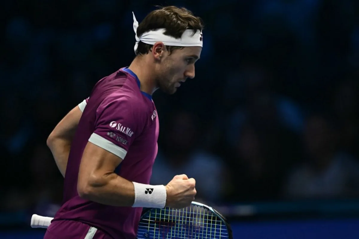 Norway's Casper Ruud reacts during his match against Russia's Andrey Rublev at the ATP Finals tennis tournament in Turin on November 15, 2024.  Marco BERTORELLO / AFP