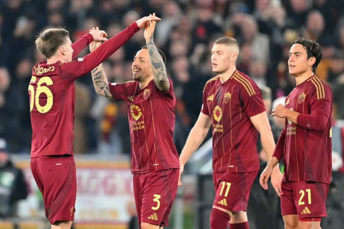 Roma's Spanish defender #03 Jose Tasende celebrates scoring his team's first goal with teammates Roma's Belgian forward #56 Alexis Saelemaekers, Roma's Ukrainian forward #11 Artem Dovbyk and Roma's Argentine forward #21 Paulo Dybala during the EUFA Europa League football match between AS Roma and Eintracht Frankfurt at the Olympic stadium in Rome, on January 30, 2025.  Andreas SOLARO / AFP