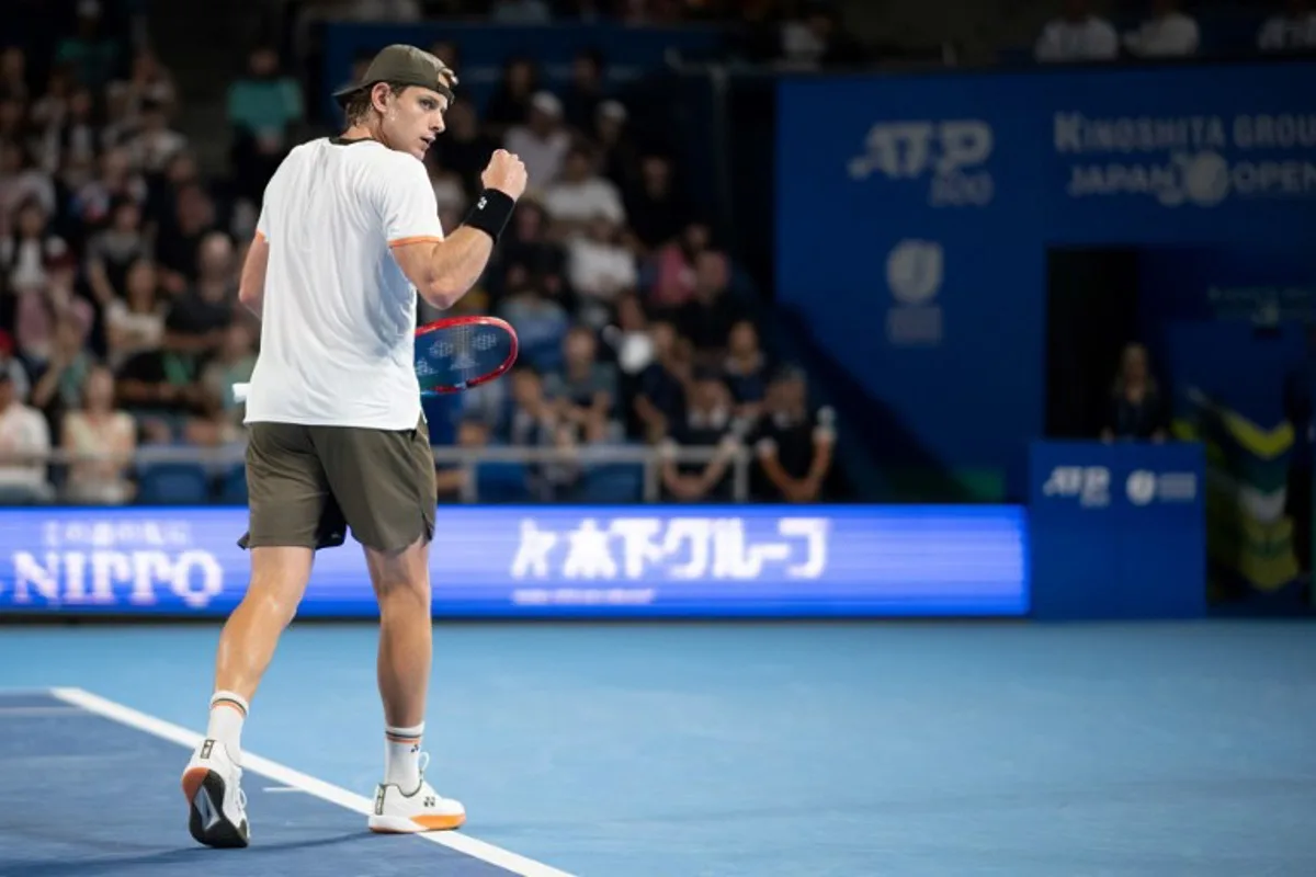 Belgium's Zizou Bergs reacts during his men's singles match against Spain's Carlos Alcaraz at the ATP Japan Open tennis tournament in Tokyo on September 27, 2025.  Philip FONG / AFP