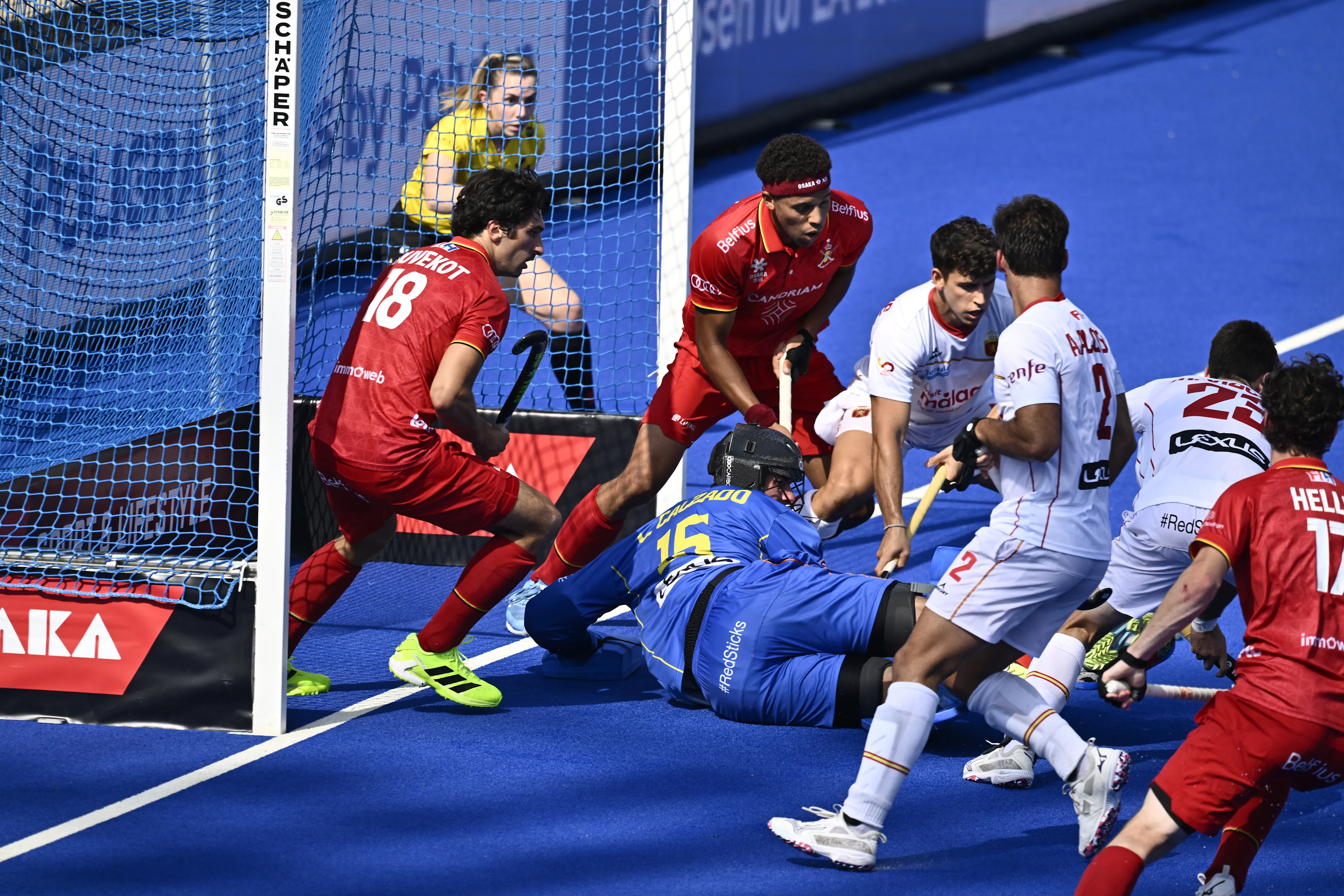 Spanish goalkeeper Luis Calzado and Belgium's Roman Duvekot (L) pictured in action during a hockey game between Spain and the Belgian national team Red Lions, match 3/3 in the pool stage of the 2025 men's European championships, Tuesday 12 August 2025 in Monchengladbach, Germany. BELGA PHOTO ERIC LALMAND