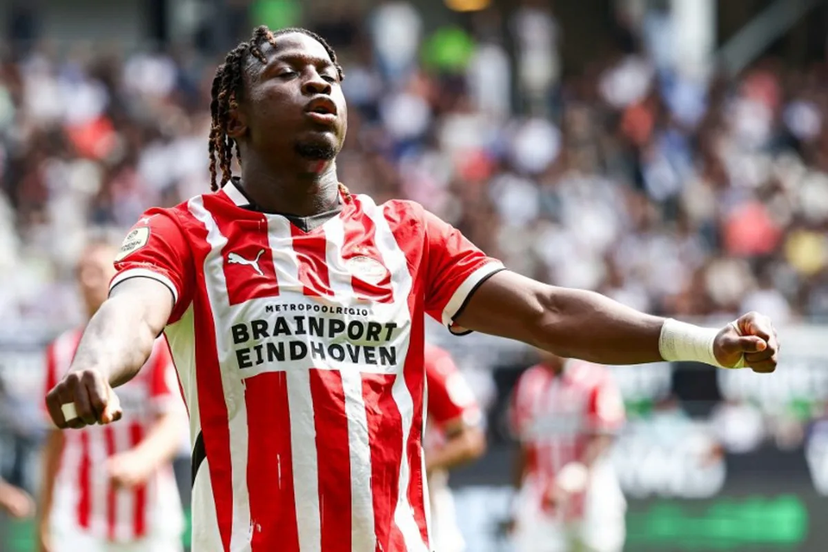 PSV Eindhoven's Belgian forward #11 Johan Bakayoko after scoring his team's third goal during the Dutch Eredivisie football match between Heracles Almelo and PSV Eindhoven at the Asito stadium, in Almelo, on August 18, 2024.  Vincent Jannink / ANP / AFP