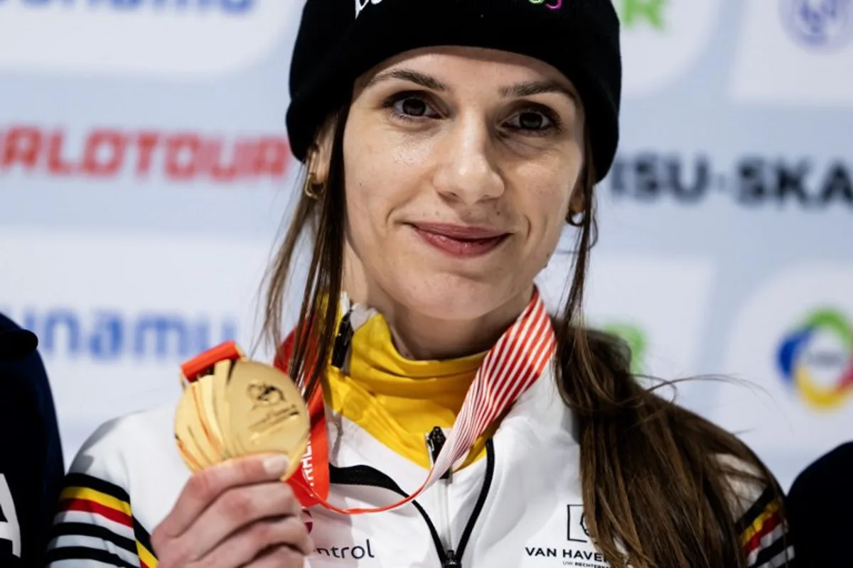 Gold medalist Belgium's Hanne Desmet poses on the podium of the Women 1500m Finals during the 2024/2025 ISU Short Track Speed Skating World Cup Milan 2025, part of a Milano Cortina 2026 Winter Olympic Games test event, at the Milano Speed Skating Stadium on February 16, 2025.   MARCO BERTORELLO / AFP