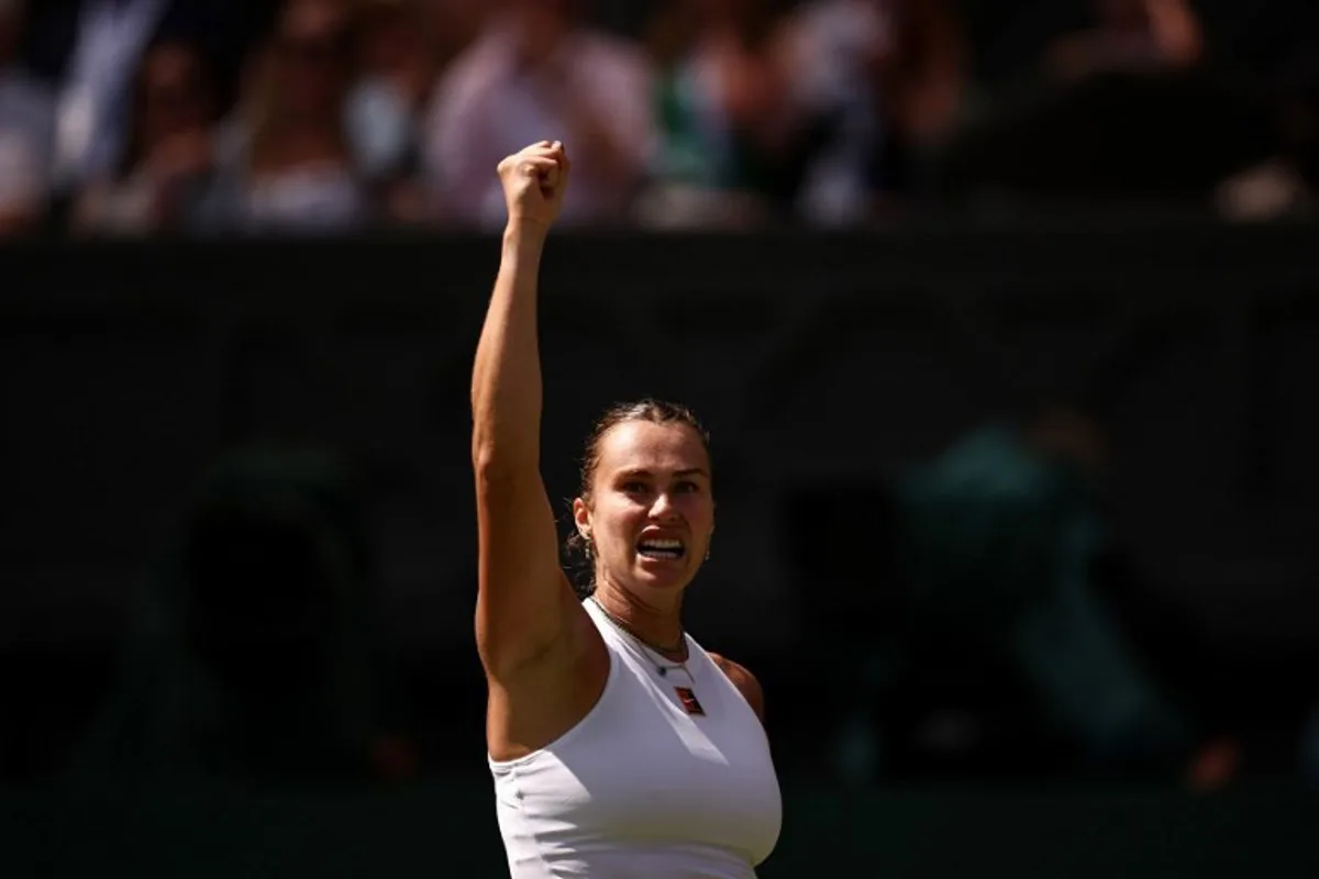 Belarus's Aryna Sabalenka celebrates after winning a point against US player Amanda Anisimova during their women's singles semi-final tennis match on the eleventh day of the 2025 Wimbledon Championships at The All England Lawn Tennis and Croquet Club in Wimbledon, southwest London, on July 10, 2025. HENRY NICHOLLS / AFP