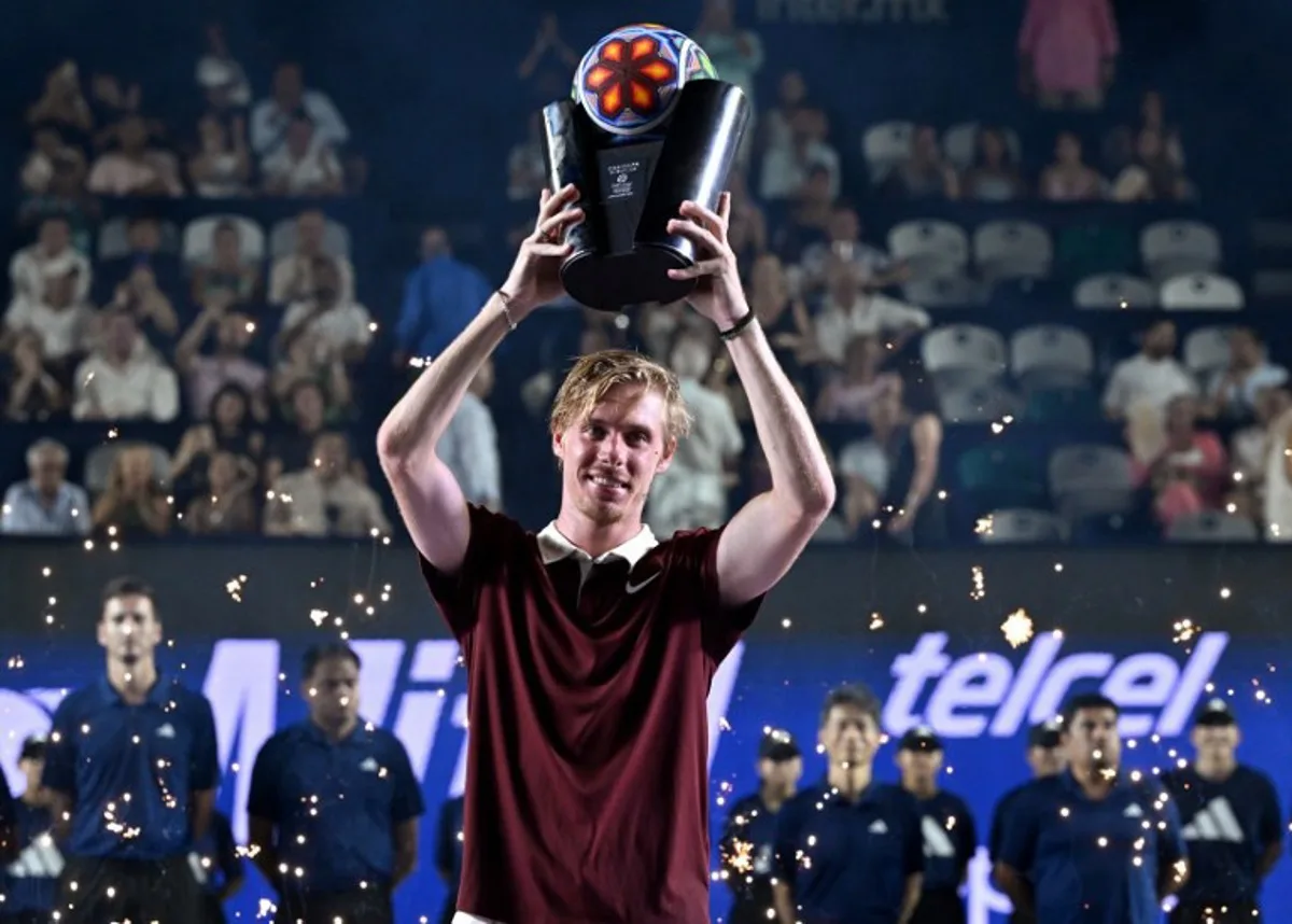 Canada's Denis Shapovalov celebrates with his trophy after defeating US' Aleksandar Kovacevic during the Mexico ATP Open men's singles tennis final match at the Cabo Sports Complex in Los Cabos, Baja California, Mexico, on July 19, 2025. Alfredo ESTRELLA / AFP
