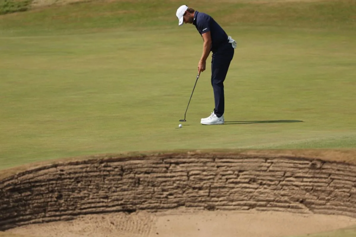 Belgium's Thomas Detry putts on the 1st green on day three of the 154th Open Golf championship at Royal Birkdale Golf Club near Southport in north-west England on July 18, 2026. Adrian Dennis / AFP