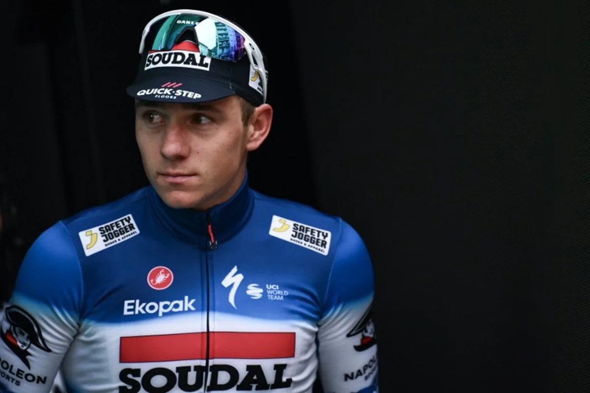 Soudal Quick-Step team's Belgian rider Remco Evenepoel looks on at the podium area after placing second in the 118th edition of the Giro di Lombardia (Tour of Lombardy), a 252km cycling race from Bergamo to Como on October 12, 2024.  Marco BERTORELLO / AFP