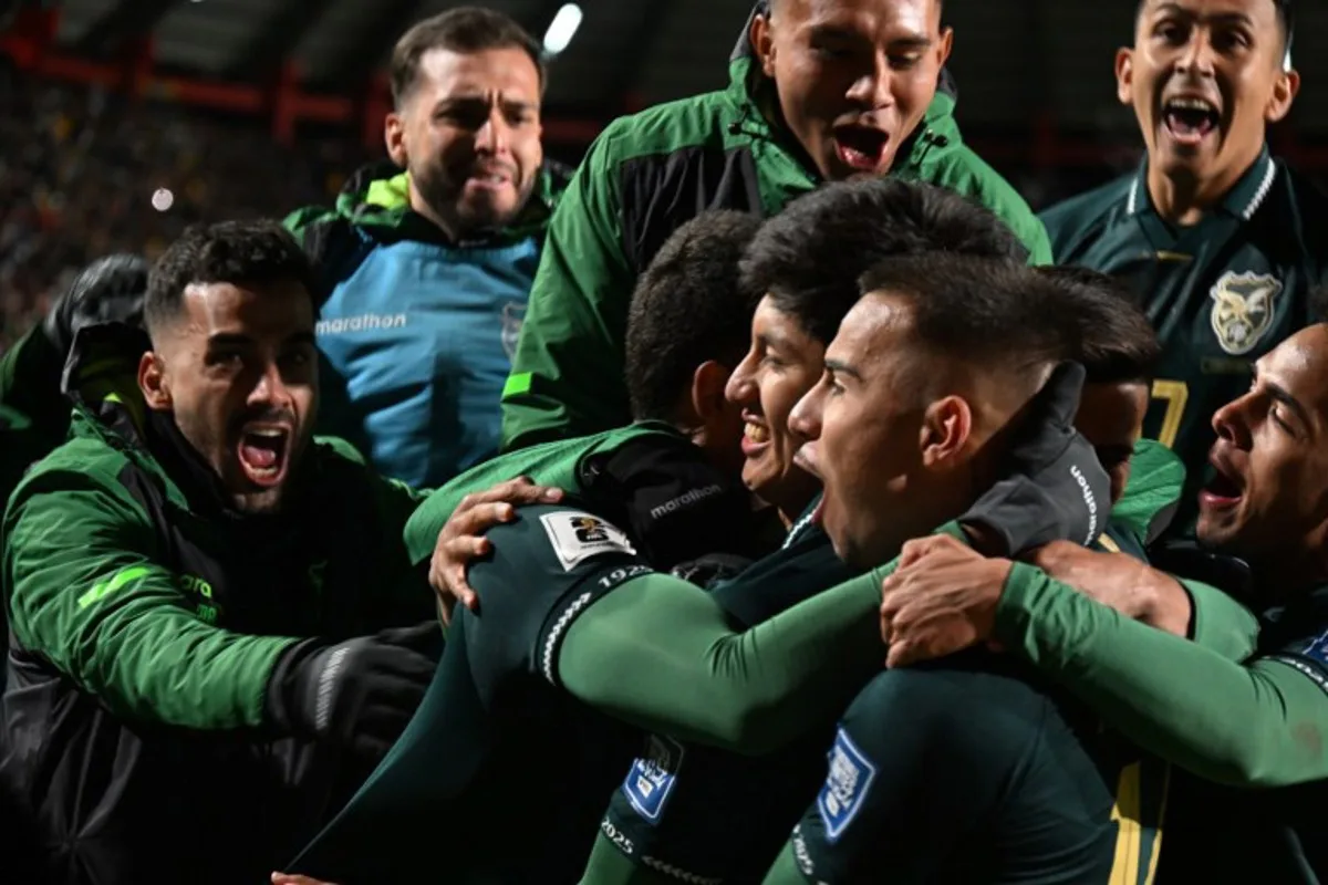 Bolivia's forward #07 Miguel Terceros (C) celebrates with his teammates after scoring his team's first goal during the 2026 FIFA World Cup South American qualifiers football match between Bolivia and Brazil, at the Municipal de El Alto stadium, in El Alto, La Paz department, Bolivia on September 9, 2025. AIZAR RALDES / AFP