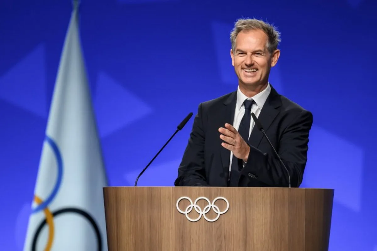 President of the Organizing Committee for the Alpes 2030 Winter Olympics Edgar Grospiron speaks during an extraordinary session of the International Olympic Committee (IOC) in Lausanne on June 25, 2026. The roughly 100 members of IOC approved on June 25, 2026 the re-inclusion of ski mountaineering in the program for the Alpes 2030 Olympic Winter Games, which will take place in the French Alps, after the "additional sport" made its Olympic debut at Milan-Cortina in 2026. Fabrice COFFRINI / AFP