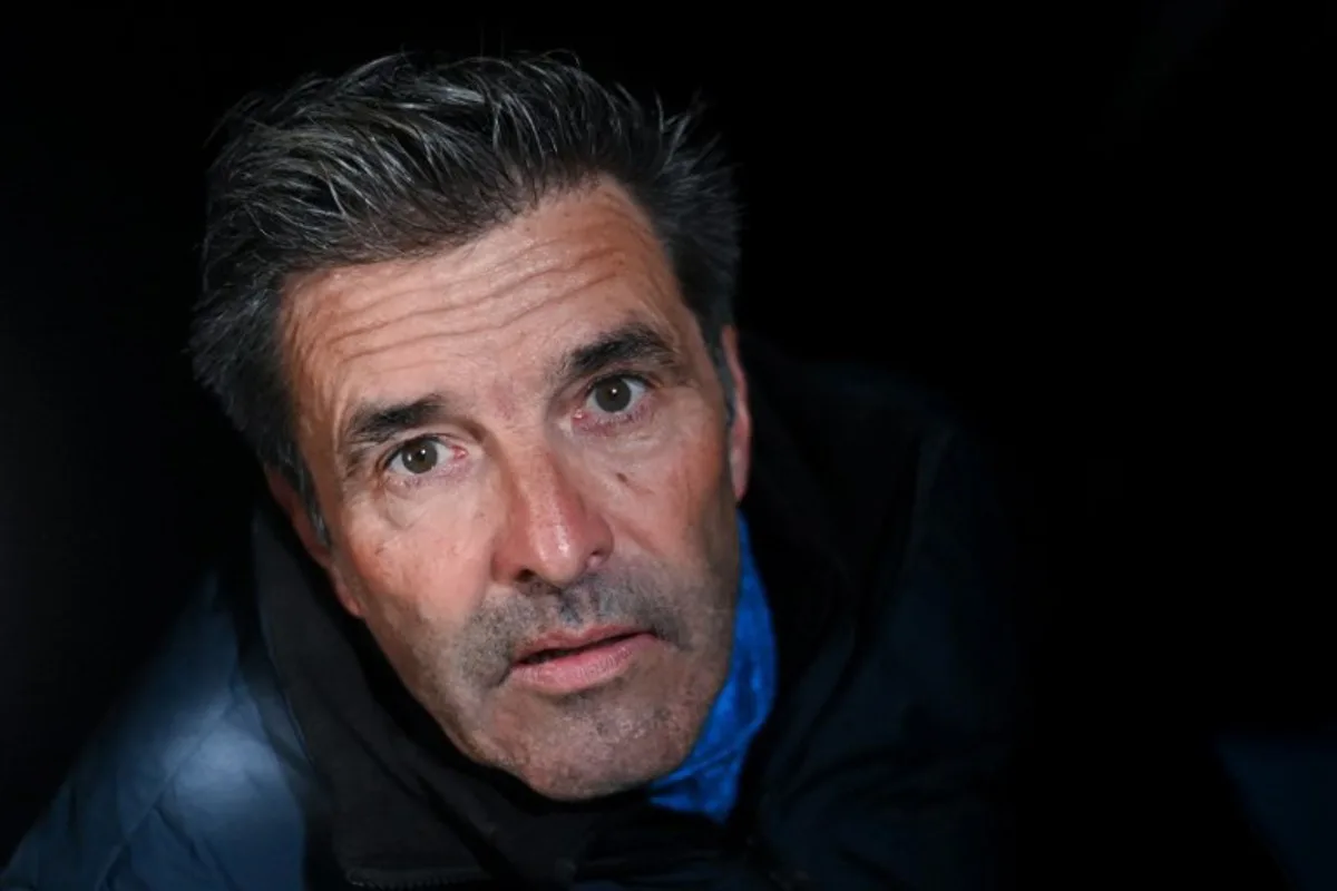 Belgian skipper Denis Van Weynbergh poses aboard his Imoca monohull "D'ieteren Group" ahead of the 10th edition of the Vendee Globe around the world monohull solo sailing race, at the Vendee Globe village in Les Sables-d'Olonne, western France on November 5, 2024.   Sebastien Salom-Gomis / AFP