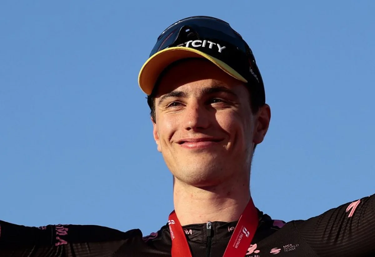 Team Visma-Lease a Bike's Dutch rider Olav Kooij celebrates on the podium after winning the 21st and last stage of the 108th Giro d'Italia cycling race of 143kms from Rome to Rome on June 1, 2025. Luca Bettini / AFP