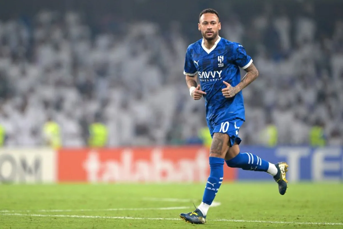 Hilal's Brazilian forward #10 Neymar runs on the pitch during the AFC Champions League group B football match between UAE's Al-Ain and Saudi's Al-Hilal at the Hazza bin Zayed Stadium in al-Ain on October 21, 2024.  AFP