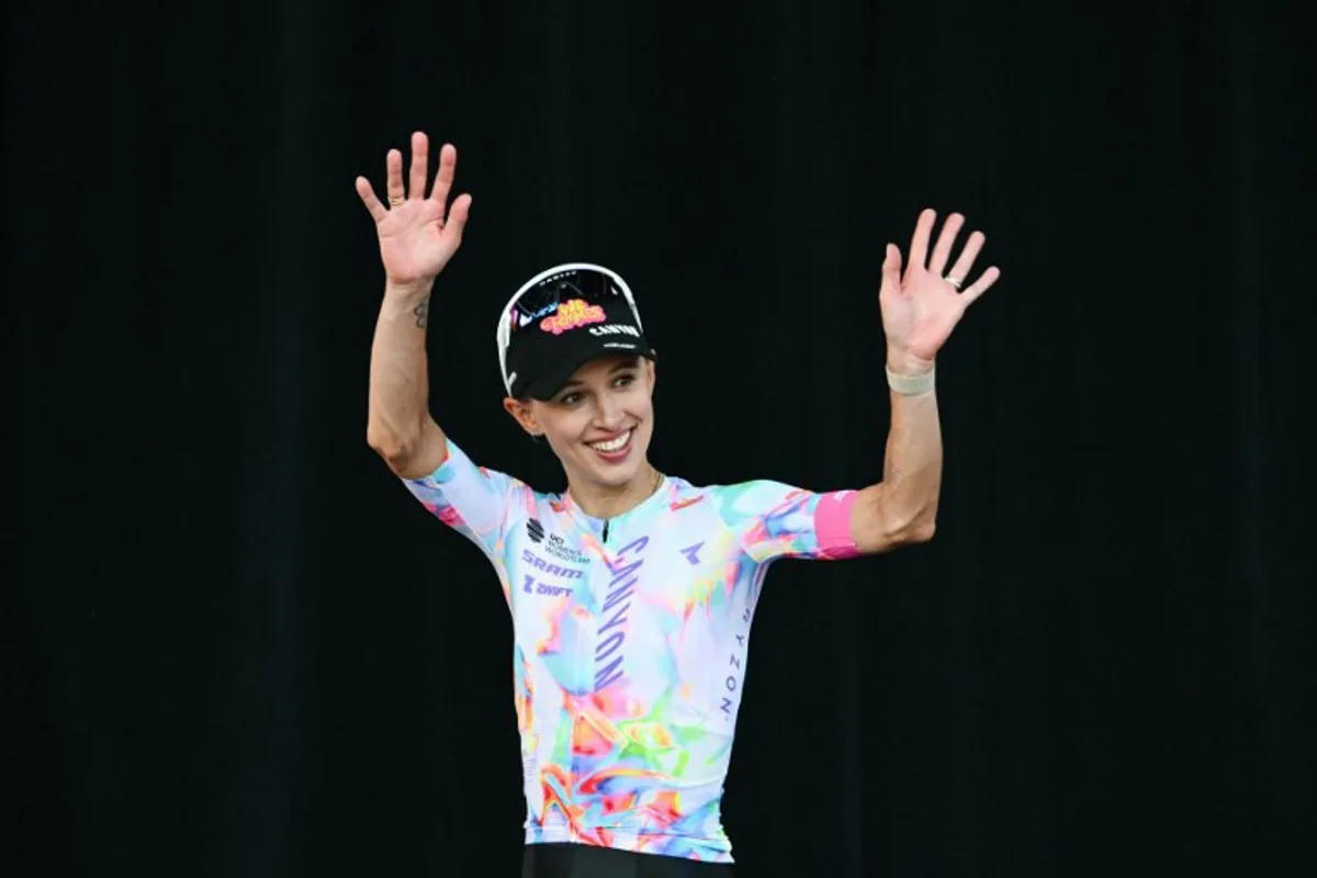 Canyon//SRAM zondacrypto's Polish rider Katarzyna Niewiadoma celebrates on the podium with the most combative rider's award after the 9th and final stage of the fifth edition of the Women's Tour de France cycling race, 99.2 km from Nice to Nice, southeastern France on August 9, 2026. NICOLAS TUCAT / AFP